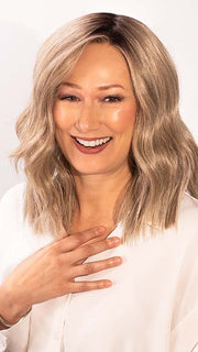 Tanya is wearing BIG SPENDER by RAQUEL WELCH  in color RL17/23SS ICED LATTE MACCHIATO | Honey Blonde shaded with Cool Blonde
