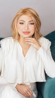 Maha is wearing the UNTOLD STORY by RAQUEL WELCH in color RL14/22 PALE GOLDEN WHEAT | Dark Blonde Evenly Blended with Platinum Blonde