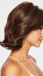 CROWD PLEASER has dramatic side swept bangs and long, subtle layering throughout. 