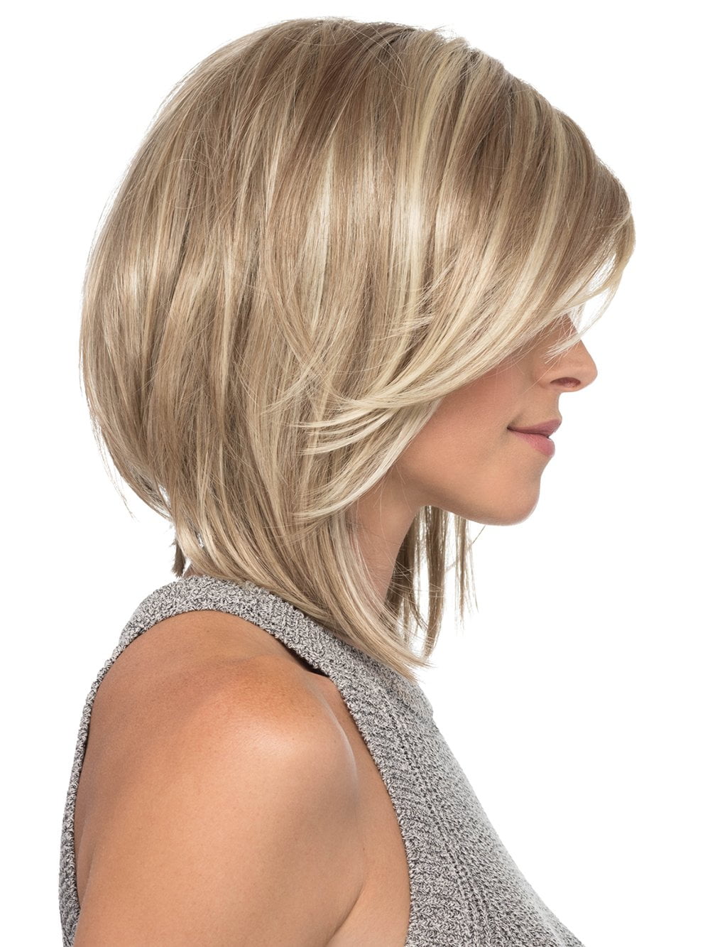 Her slightly angled layers and flowing side bangs make this shoulder length style simple and sleek for a perfect evening