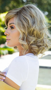 Brave The Wave Wig by Raquel Welch is punctuated by soft, gentle layering that accentuates the undulating curl pattern throughout.