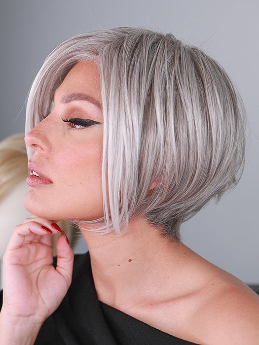 Roxie wigs.com model wearing 56F51 OYSTER | Light Grey with 20% Medium Brown Front, graduating to Grey with 30% Medium Brown Nape