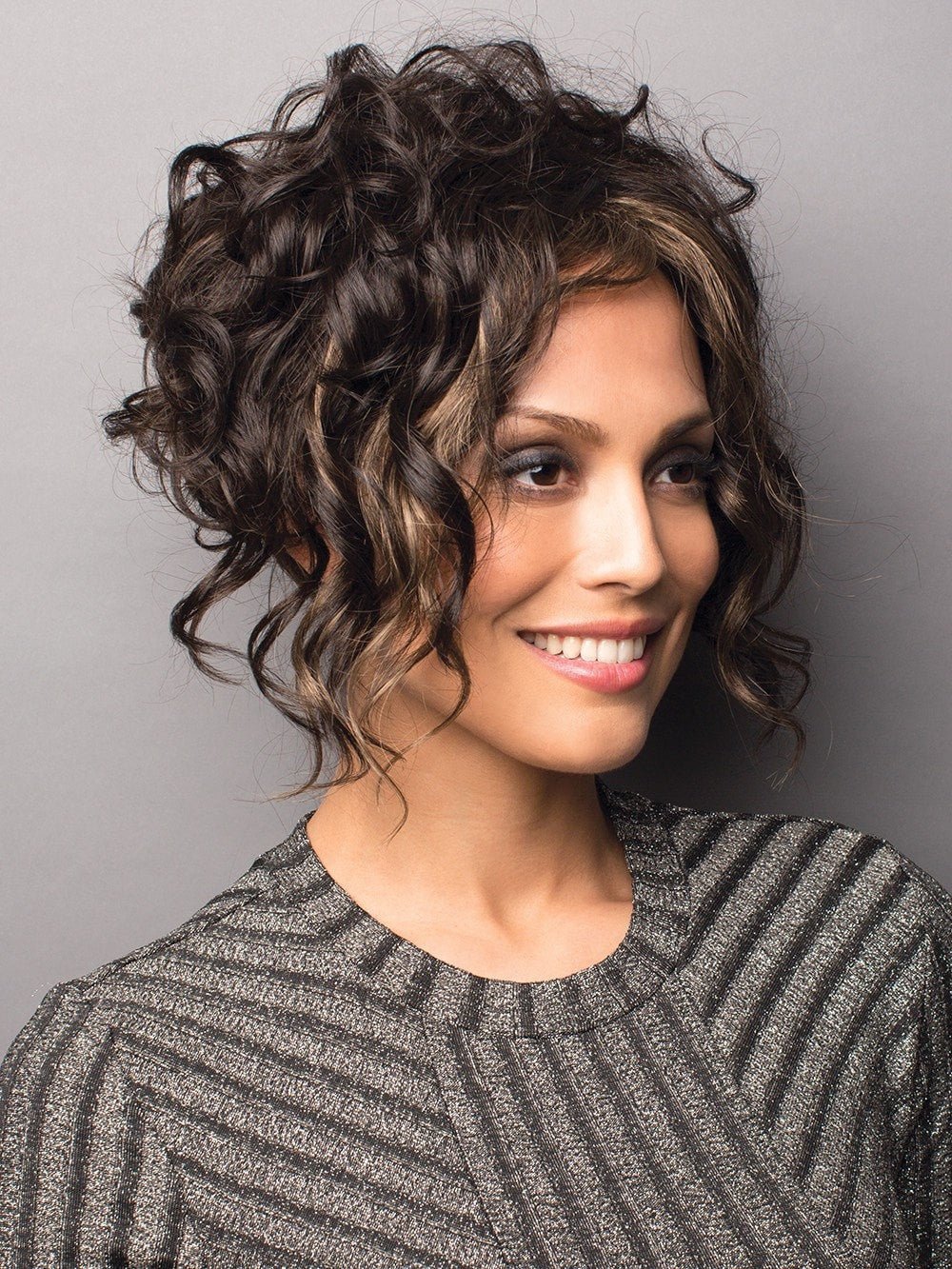 A bold A-Line cut with sexy loose curls to  frame the face.