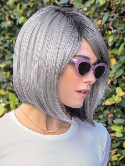 The Vada Wig by Amore is a sleek bob framing the chin featuring a natural side swept fringe