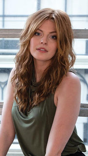Long bangs frame the face
