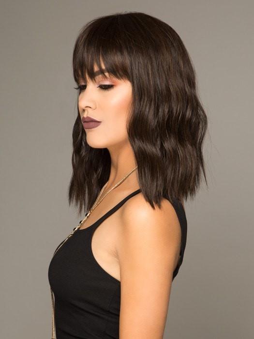 A mid-length cut with full bangs and the perfect wave!