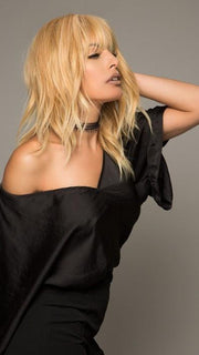 The full bang and center part create a modern and effortless look