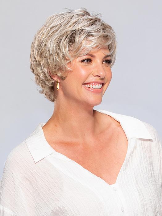 A short styled wig with all-over layering, long crown layers, a nape with flipped-out layers, and ultra-light construction