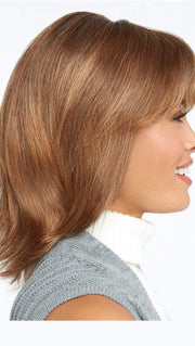 Featuring razor tapered bangs that blend into long razor-cut layers in the sides and back