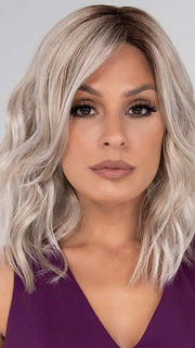 Kaylee features loose waves that cascade below the shoulders