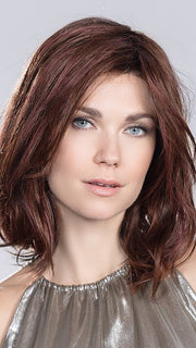A mid-length wig with flattering face framing layers