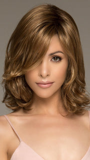 The Carrie Wig by Noriko is a medium length style that has a balanced body evoking a romantic quality sure to capture attention