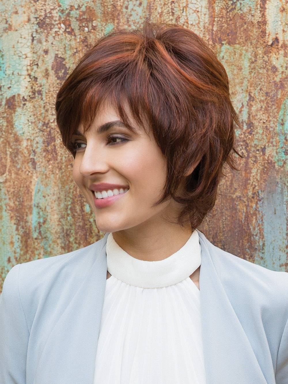 Give this short wig a shake and a quick spritz to awaken the tousled style. Then, finger style to achieve the desired look