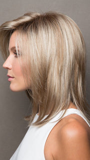 Jackson by Noriko is a voluminous, layered mid-length cut. It embodies feminine style with its subtle pointed ends and modern tease.