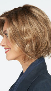 This style features sophisticated layers, bounced body, and the perfect diagonal long bang