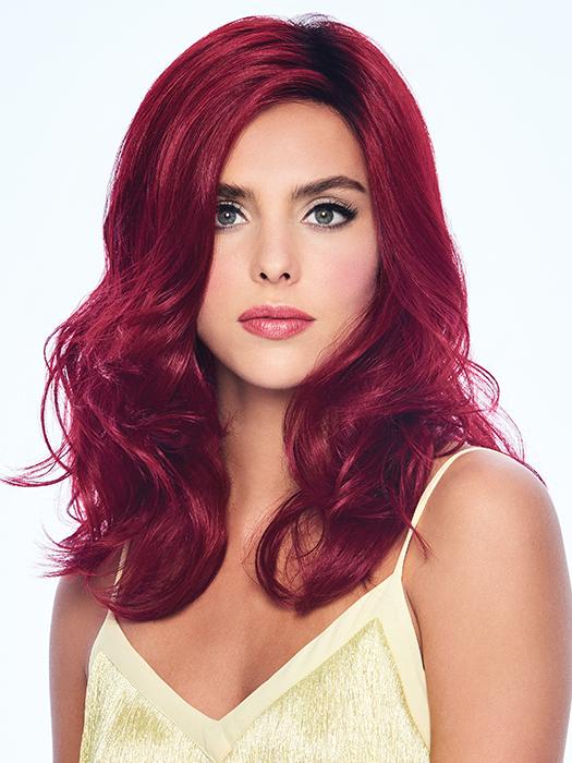 The Poise & Berry Wig by Hairdo has long voluminous locks in an intoxicating cranberry red hue