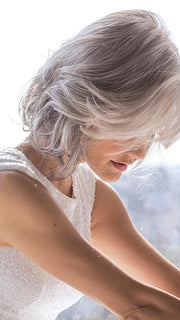 This style is a long bob cut with layers around the face for a flattering and natural look