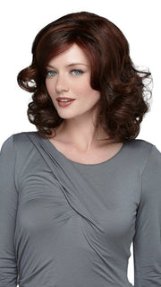 A shoulder-length wig with soft voluminous curls and a smooth wave top