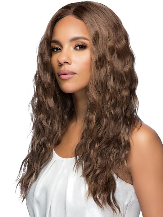 A long, layered style with loose body waves and an invisible center part