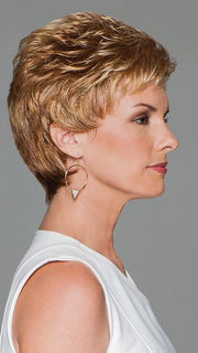 A short, boy cut style featuring all-over layering and loose curls for gorgeous volume