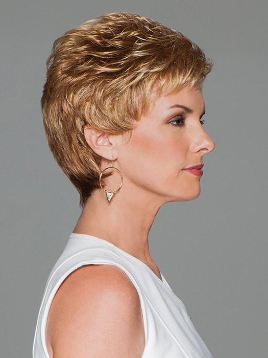 A short, boy cut style featuring all-over layering and loose curls for gorgeous volume