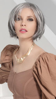 The fringe falls at eye level and is able to be pulled back or swept to the side with ease