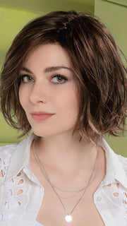 The fringe sweeps to the side for an added appeal