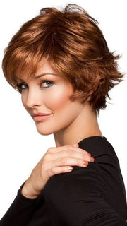 A short, textured and layered cut with a wispy bang and flipped ends
