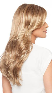 Cascading layers are softly curled to add loose waves 