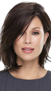 Styled with a deep side part 