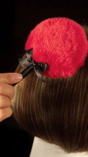 The Wig Wand magically eliminates shine from synthetic wigs.