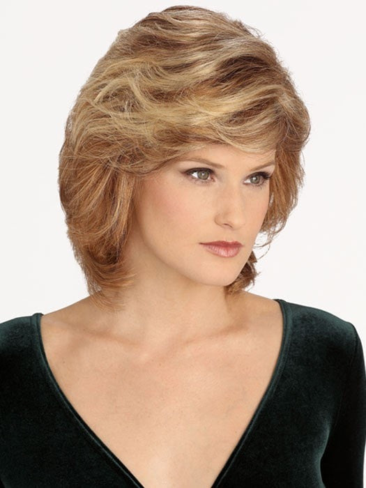 Featuring a monofilament top, this wavy synthetic hair wig allows styling versatility with a natural looking part. 