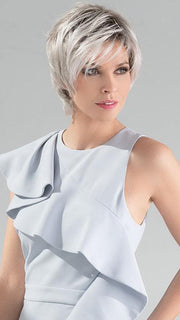 This straight synthetic cut provides effortlessly natural flair