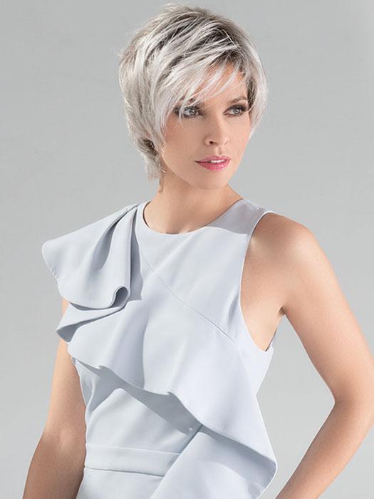 This straight synthetic cut provides effortlessly natural flair
