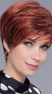 With a longer side-swept bang and the combination of slightly longer layers in the crown, you have the perfect feminine feel with this modern cropped style