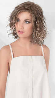 A beautifully feminine style with loose beach waves