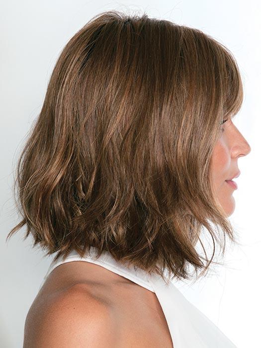The Alexi Wig by Noriko is a textured bob with bangs that frames the face perfectly creating a modern fit.