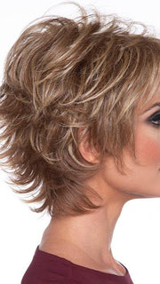 Combining rakish layering with wispy bangs for a chic styling highlights your features beautifully