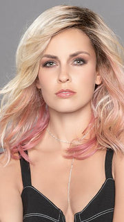 TABU by ELLEN WILLE in ROSE BLONDE ROOTED | Medium Dark Brown Roots that melt into a Pale Golden Blonde with a Mixture of Pink Tones Underneath with Darker Roots. 