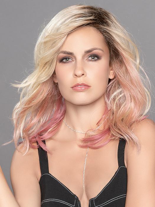 TABU by ELLEN WILLE in ROSE BLONDE ROOTED | Medium Dark Brown Roots that melt into a Pale Golden Blonde with a Mixture of Pink Tones Underneath with Darker Roots. 