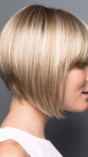 Look like you’ve just stepped out of the salon with this sleek angled cut that features bold, blunt bangs and a tapered back. 