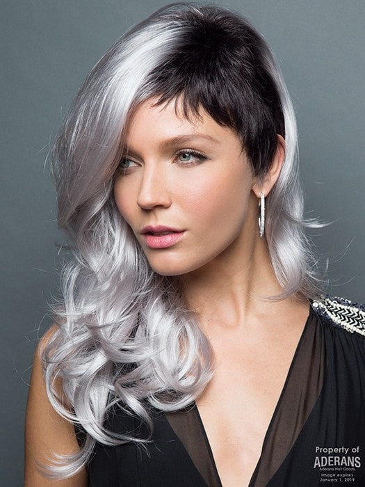 Long, loose  waves accentuated by a short, chic cut on left side. | Color: Illumina-R Violet Silver with Dark Roots. PPC MAIN IMAGE