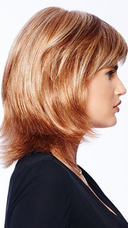This style has razor tapered bangs that blend into long, razor-cut layers in the sides and back