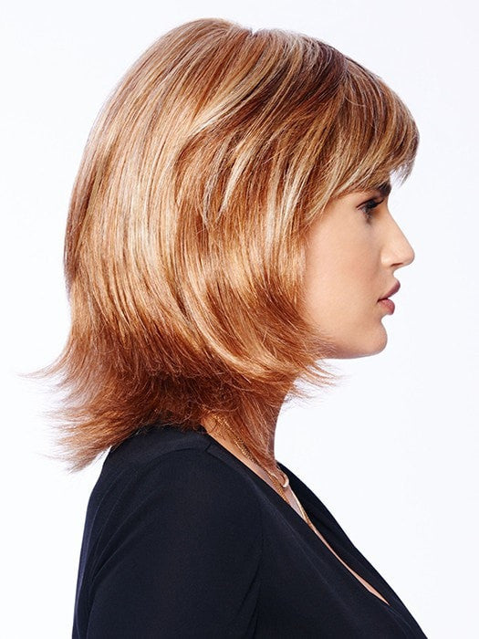 This style has razor tapered bangs that blend into long, razor-cut layers in the sides and back