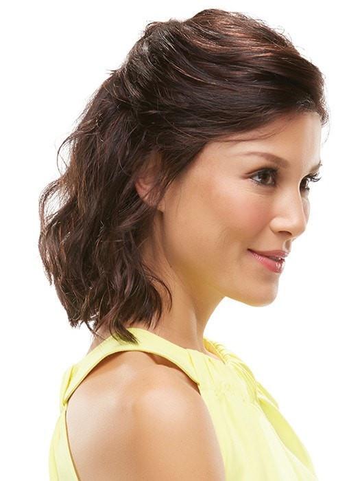 Styled half up with loose waves in front of the ear
