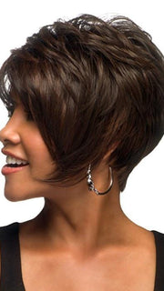 Adorable short pixie bob with angle pointed sides featuring heat friendly synthetic fiber.